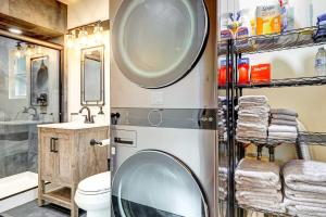 a bathroom with a washing machine and a sink at Hike, Fish and Explore California Cabin with Deck! in Long Barn +22 photos