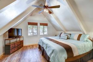 a bedroom with a bed and a ceiling fan at Hike, Fish and Explore California Cabin with Deck! in Long Barn