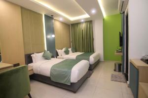 Postel nebo postele na pokoji v ubytování Hotel Aikawa