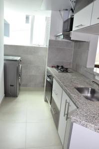 Kuchyň nebo kuchyňský kout v ubytování Apartaestudio Norte de Armenia excelente ubicacion