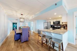 a kitchen and dining room with a table and chairs at Summer Beach 508 in Ocean City