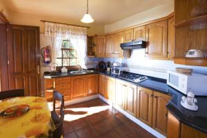 Kuchyň nebo kuchyňský kout v ubytování Casa Rural Olga + 14 fotografií