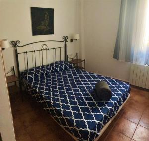 Posteľ alebo postele v izbe v ubytovaní APARTAMENTOS CASERIA DE COMARES