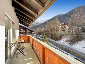 a balcony with a view of a snow covered mountain at Eagle apartment with splendid and direct view of the Matterhorn in Zermatt