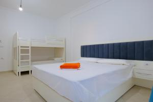 Postel nebo postele na pokoji v ubytování Davide Rooms