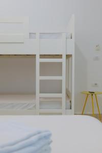 Postel nebo postele na pokoji v ubytování Davide Rooms