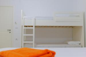 Postel nebo postele na pokoji v ubytování Davide Rooms