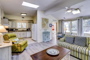 a living room with a couch and a table at Moonshell 3 in Hilton Head Island