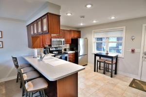 a kitchen with a sink and a counter top at Unit 207 2 BDRM 2 BA condo in Birchwood