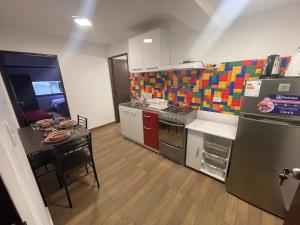 a small kitchen with a stove and a table at 19 Departamento en el centro de Miraflores in Lima