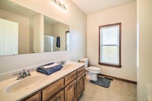 a bathroom with a sink and a toilet at Waterfront Montross Home with Private Boat Slip! in Montross +58 photos