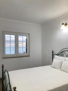 Tempat tidur dalam kamar di Casa da Nazaré