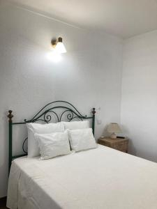 Tempat tidur dalam kamar di Casa da Nazaré