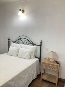 Tempat tidur dalam kamar di Casa da Nazaré
