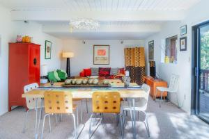 a dining room with a table and chairs and a couch at The Silver Lady in Cambria