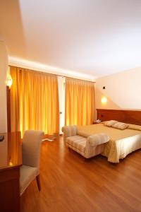 Posteľ alebo postele v izbe v ubytovaní Hotel Panoramic Montepulciano