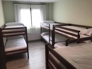A bed or beds in a room at Las Ermitas de Vallada