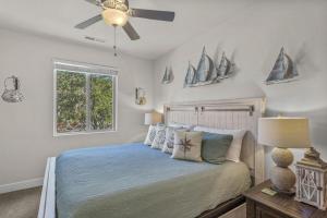 a bedroom with a bed with a ceiling fan at PV 110 Themed Rooms, PS4, Ping Pong, Pack n` Play, Electric Fire Place, Games, and More in Santa Clara