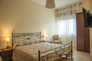 Postel nebo postele na pokoji v ubytování B&B La Cannalia