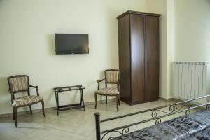 TV a/nebo společenská místnost v ubytování B&B La Cannalia