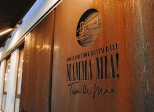 a sign on the side of a train at Mamma Mia Hotel Boutique - Only Adults in Tossa de Mar