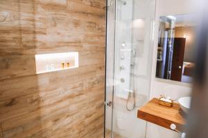a bathroom with a shower and a sink at Mamma Mia Hotel Boutique - Only Adults in Tossa de Mar