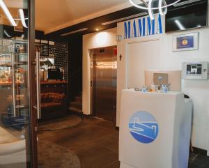 a lobby of a pharmacy with a sign on the door at Mamma Mia Hotel Boutique in Tossa de Mar