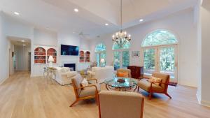 a large living room with a table and chairs at 33 Swing About in Hilton Head Island