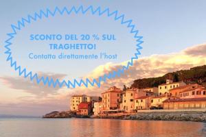 a picture of a town on the shore of the water at Appartamento La Fontina in Marciana Marina
