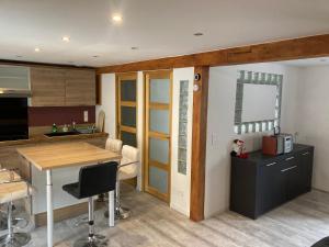 a kitchen with a table and a counter top at Gite les Remparts de Turckheim in Turckheim