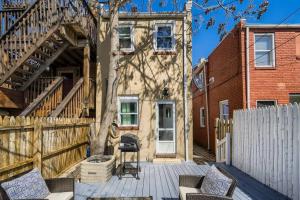 a patio with chairs and a fence and a house at Trendy Spot in Downtown Baltimore/Fellspoint in Baltimore