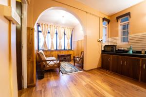 an arched hallway with an archway in a house at Augusta Villa in Darjeeling