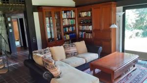 a living room with a couch and a table at Ferienhaus Province in Konz-Oberemmel