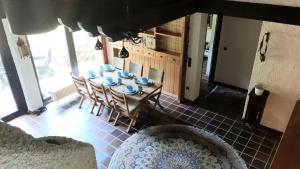 a dining room with a table and chairs in a room at Ferienhaus Province in Konz-Oberemmel