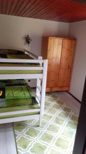 a bedroom with a bunk bed and a closet at Ferienhaus Province in Konz-Oberemmel