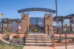 a gate with a staircase in front of a building at Paradise Village 95 Kid Friendly Home, Private Hot Tub, Nintendo Switch, Air-Hockey, Resort Style Pool and Water Park in Santa Clara
