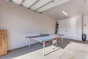 a ping pong table in the middle of a room at 96 PV Luxury Getaway with Private Hot Tub, Ping Pong, Community Pool, Water Park and Lazy River in Santa Clara