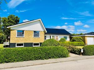a house with solar panels on the roof at Casa Korallen - Central Apartment in Varberg