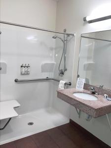 a bathroom with a sink and a shower at Candlewood Suites Olathe, an IHG Hotel in Olathe