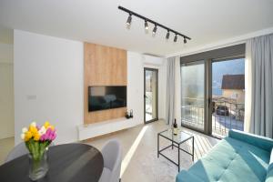 a living room with a couch and a table at Solaris Lux Apartments in Kotor