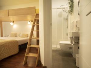 Cama ou camas em um quarto em Alojamientos Cantíber
