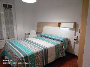 Posteľ alebo postele v izbe v ubytovaní CASA PUERTA DEL BOROSA