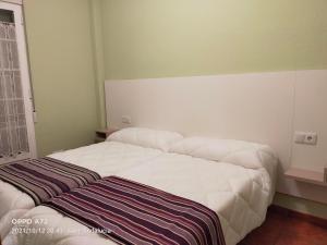 Posteľ alebo postele v izbe v ubytovaní CASA PUERTA DEL BOROSA