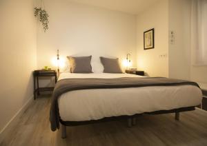Cama ou camas em um quarto em Alojamientos Cantíber