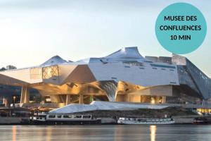 a building with the words music des commissions at L'Impérial - St Genis Centre in Saint-Genis-Laval