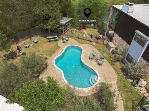 an overhead view of a swimming pool in a yard at Guadalupe Getaway in New Braunfels +22 photos