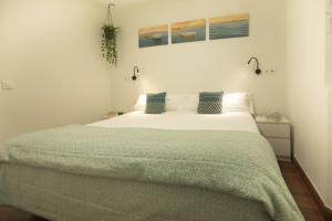 Cama ou camas em um quarto em Alojamientos Cantíber
