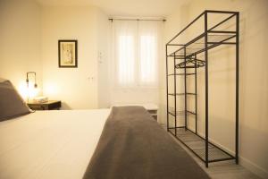 Cama ou camas em um quarto em Alojamientos Cantíber