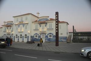 a large white building with a sign in front of it at AVEIRO WONDER STAY in Aveiro