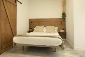 Cama ou camas em um quarto em Alojamientos Cantíber